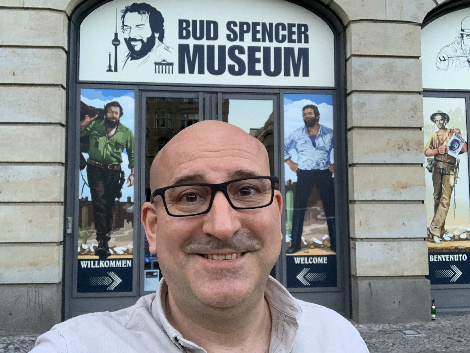 Marin standing in front of the entrance of a museum dedicated to Bud Spencer