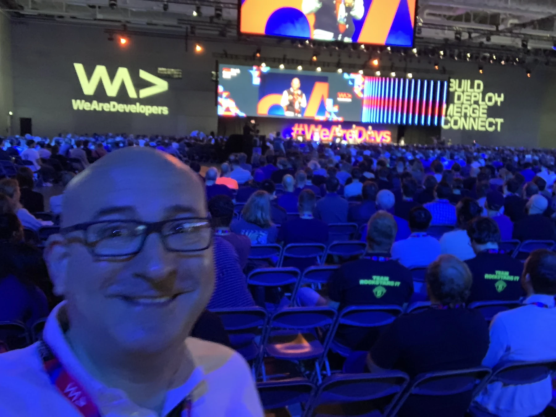 Marin at the moodily lit main stage of WeAreDevelopers 2022