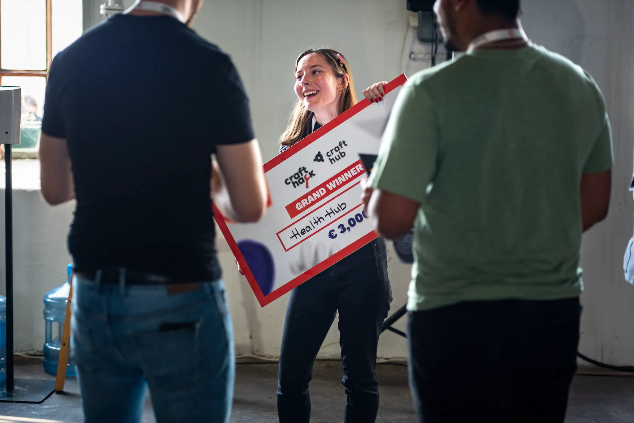 Gabriella holding the large award voucher