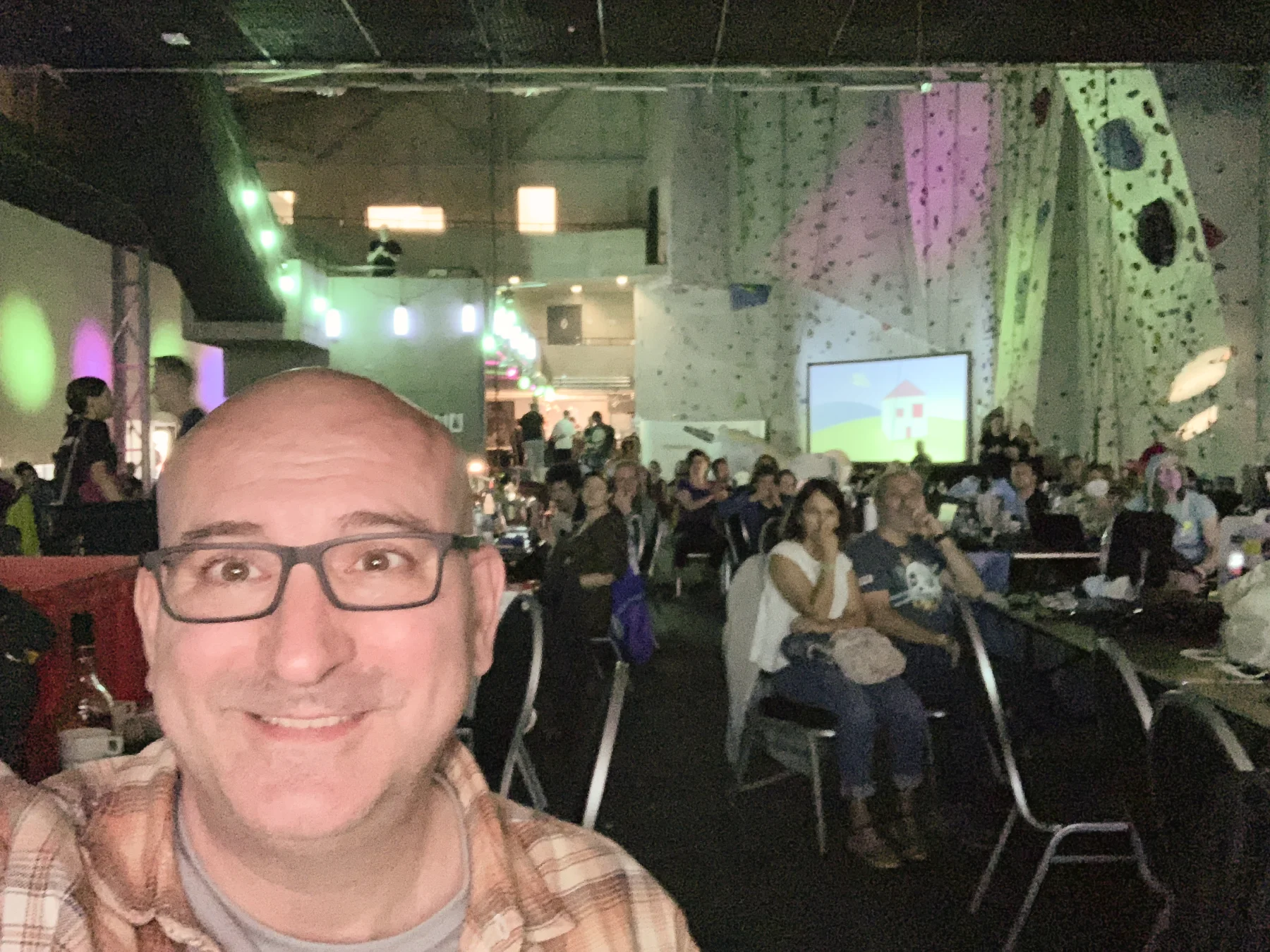 The audience watching the big screen at Evoke 2022