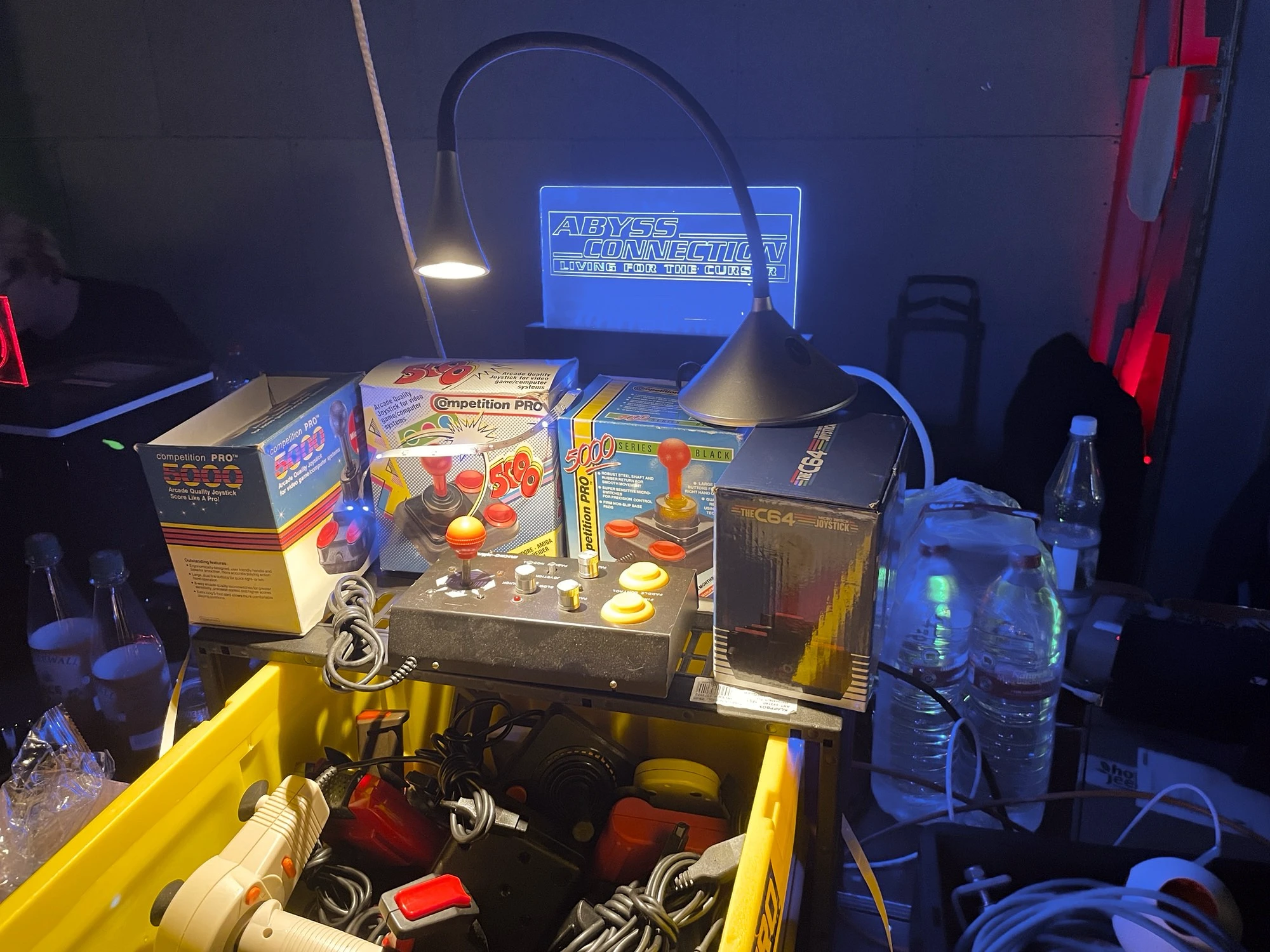 A bunch of joysticks on a table at Evoke 2024.