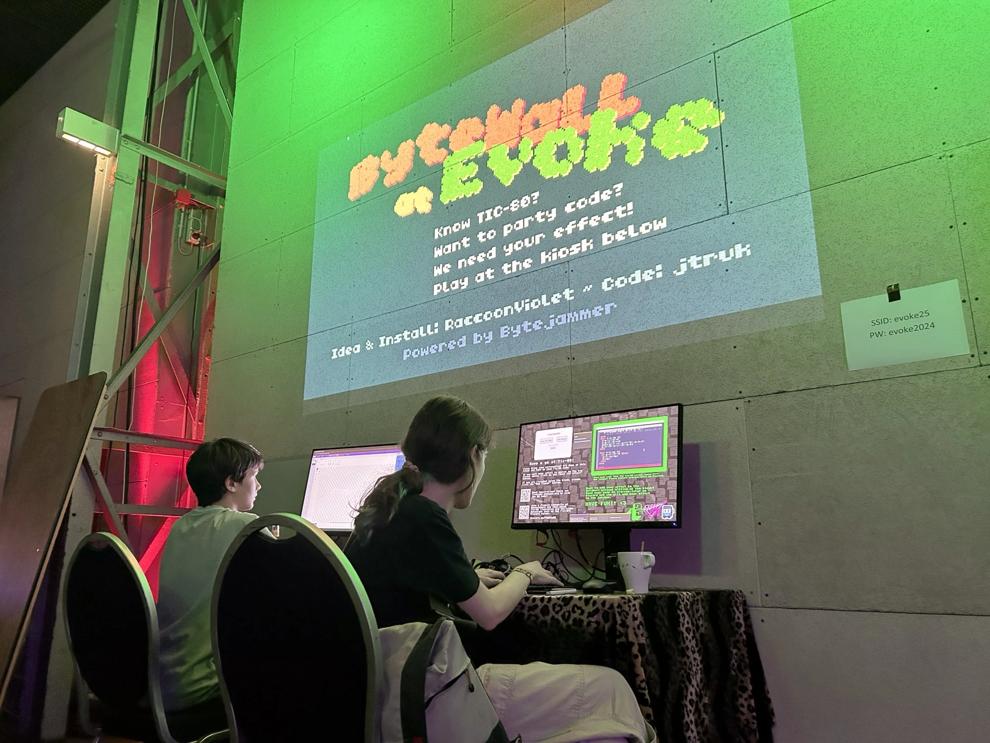 The TIC-80 corner with two young guests at the PCs